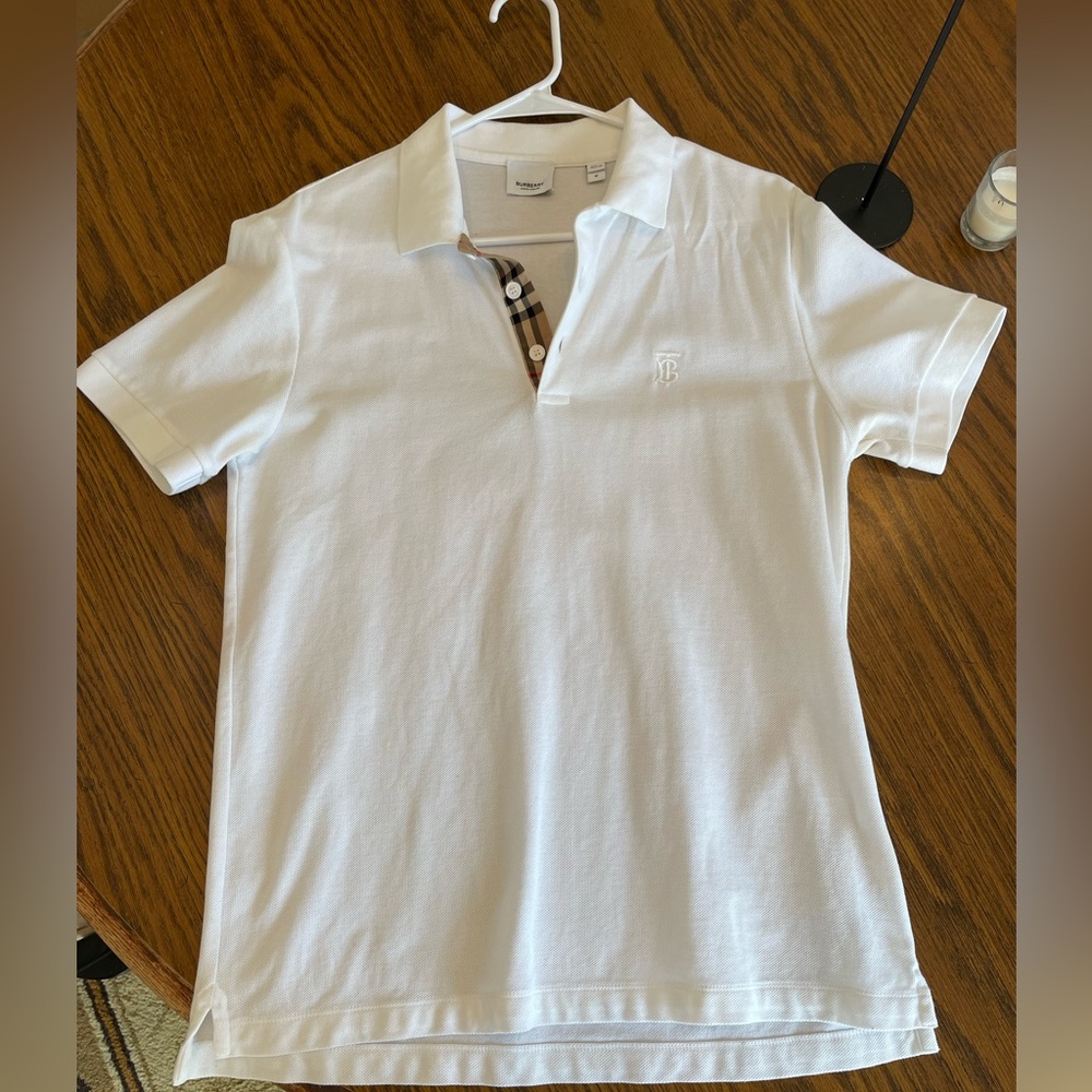 Authentic Burberry polo. Men’s size Medium. 2 tiny flaws in pictures. Worn once.